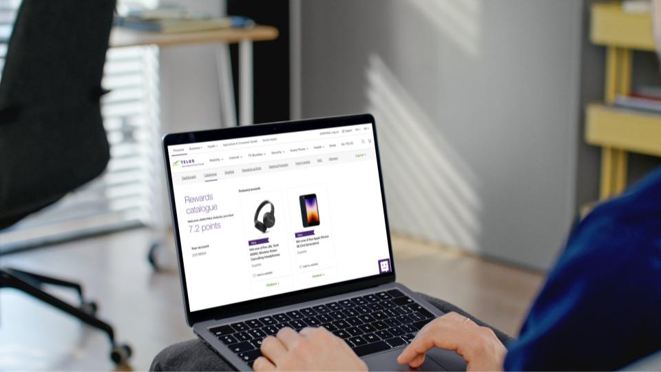 The TELUS Rewards catalogue shown on a laptop